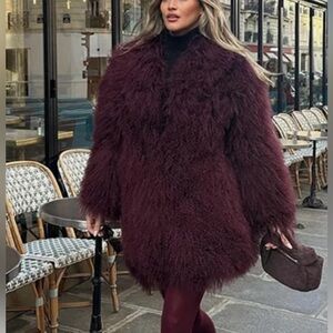 Soft fluffy, elegant burgundy coat.